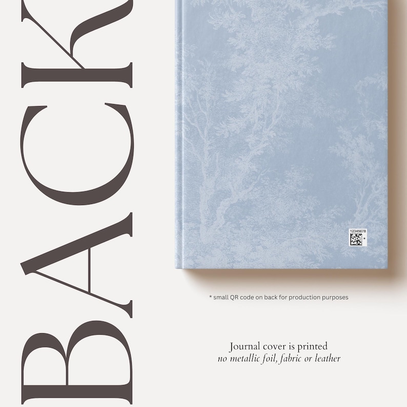 May include: A blue journal cover with a white tree pattern. The text "Journal cover is printed no metallic foil, fabric or leather" is printed on the bottom of the image.