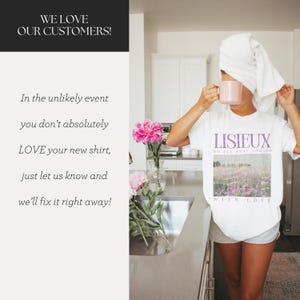 May include: White t-shirt with the word "LISIEUX" in purple, and a landscape image. The text "DO ALL THAT YOU DO" is above the image, and "WITH LOVE" is below. A person is holding a pink mug and wearing a white towel on their head.
