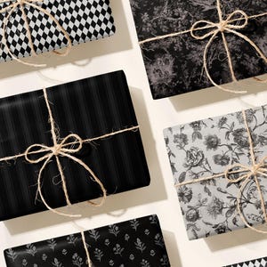 May include: An assortment of wrapped gifts with various patterns, including black and white diamond, floral, and striped designs. Each gift is tied with twine and a bow, creating a classic and elegant presentation. The gifts are arranged on a light-colored surface.