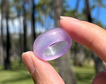 May include: A translucent purple ring with a smooth, polished finish.