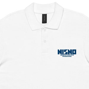 May include: White polo shirt with a blue embroidered logo that says "NISNO" and "NETWORK SECURITY INTERNATIONAL."