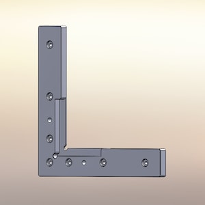 Peut inclure: Une équerre d'angle en métal argenté en forme de L avec plusieurs trous pour le montage.