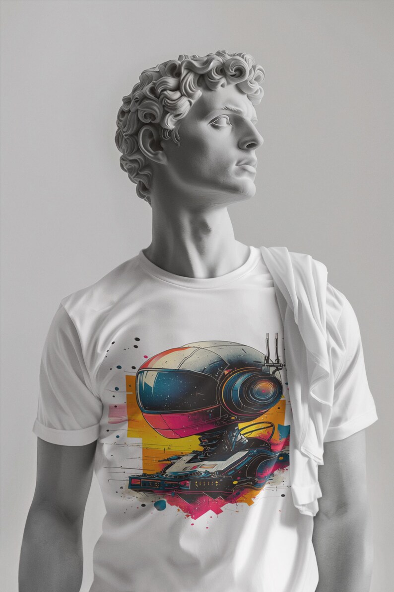 May include: A white t-shirt with a colorful graphic print of a robot wearing headphones and holding a record player. The robot is surrounded by colorful paint splatters.