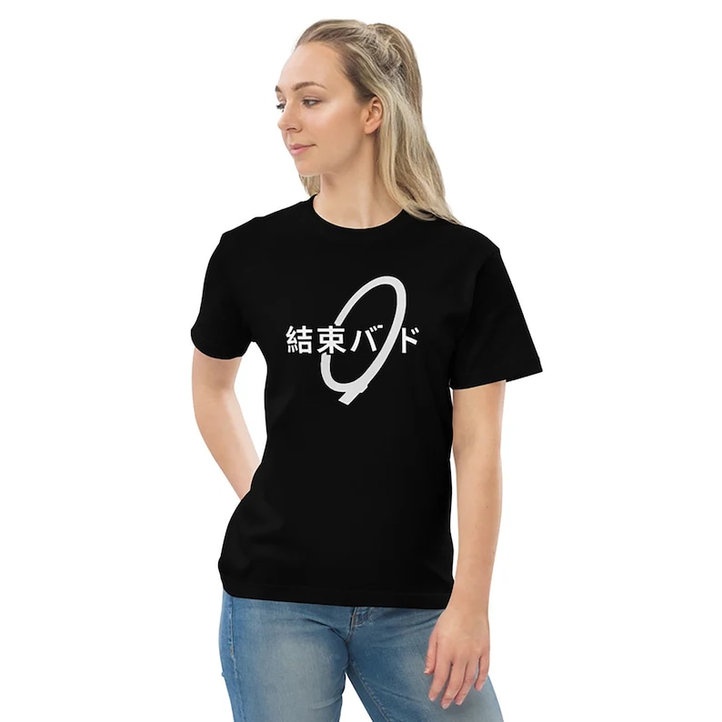 May include: Black t-shirt with a white circle design and the Japanese text "結東バッド" printed on the front.