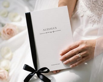 Wedding vow covers with satin ribbon.