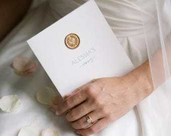 Wedding vow covers with sealing wax.