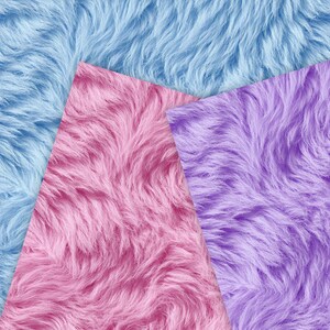 May include: A close-up of three sections of faux fur fabric in shades of blue, pink, and purple. The fur has a long, wavy texture, creating a soft and fluffy appearance. The colors are vibrant and saturated, with the pink section in the center.