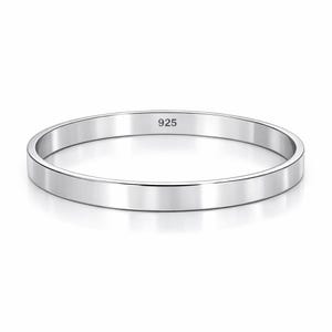 May include: A polished silver ring with a flat band. The ring has a smooth, reflective surface and the number "925" is stamped on the inside. The ring is a simple, elegant design.