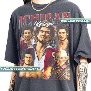 May include: Dark gray t-shirt featuring a graphic of a man with the text "ICHIBAN Kasuga". The graphic includes multiple images of the man in different poses. The shirt has a vintage look.