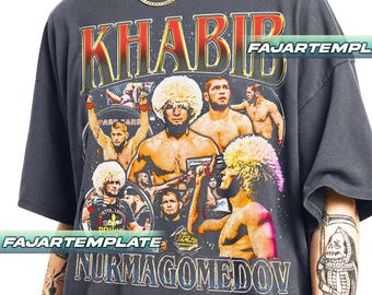 May include: Dark gray t-shirt featuring a graphic of Khabib Nurmagomedov with the text "KHABIB NURMAGOMEDOV". The design includes images of the fighter and the UFC logo. The shirt has a vintage, distressed look.