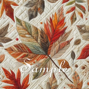 Puede incluir: Una tela acolchada con un patrón detallado de hojas de otoño en tonos naranja, rojo, marrón y verde suave sobre un fondo crema. El textil muestra costuras intrincadas y la palabra Sample en letra cursiva blanca en el centro.
