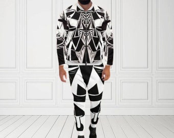 May include: A matching black and white geometric print bomber jacket and pants set. The jacket has a zipper closure and the pants have a fitted design. The set is worn by a person. The text "MAX(XX)ART" is in the top left corner.