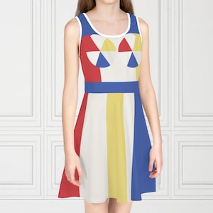 May include: A sleeveless dress with a colorful geometric design. The dress features a white neckline and a blue waist band. The bodice has red, yellow, and blue shapes. The skirt has vertical stripes of red, white, yellow, and blue.