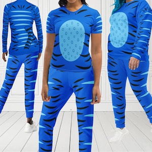May include: Three people wearing matching blue athletic wear with black tiger stripe patterns. The outfits include long-sleeve shirts, t-shirts, and pants. The shirts feature a light blue oval design with dark blue dots.