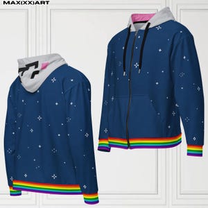 May include: A navy blue zip-up hoodie with a white and pink lined hood. The hoodie features a rainbow-colored band at the bottom and white star-like patterns. The text "MAX(XX)ART" is at the top.