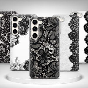 May include: A white ceramic mug with a black handle and the text "But First, Coffee" in a bold, black font. The mug is set against a blurred background, suggesting a cozy setting.