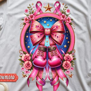 May include: White t-shirt featuring a pink ribbon design with boxing gloves, a bow, and floral accents. The design includes a star and a blue background with stars. The words "DIGITAL DOWNLOADS" are at the bottom.