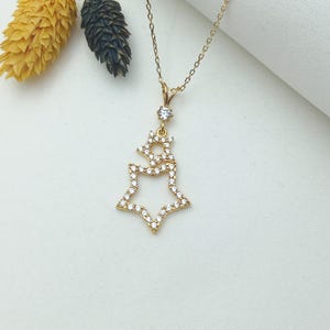 gold double star necklace, star pair charm, two star pendant, dual star jewelry, gold star duo, stylish star pendant, trendy star necklace