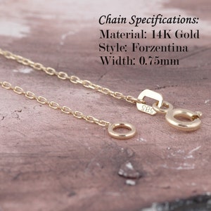 May include: A gold chain necklace with a lobster clasp. Chain Specifications: Material: 14K Gold, Style: Forzentina, Width: 0.75mm