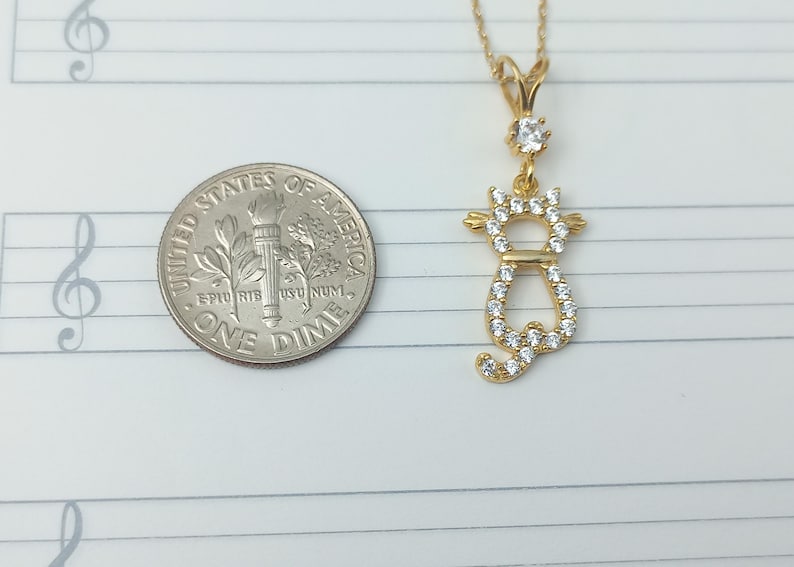 gold cat charm, cat love pendant, cat necklace, golden feline jewelry, playful cat pendant, charming kitty necklace, gold cat jewelry charm