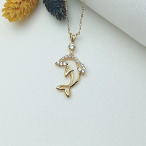 gold dolphin necklace, dolphin charm pendant, playful dolphin jewelry, gold dolphin charm, ocean dolphin necklace, marine dolphin jewelry