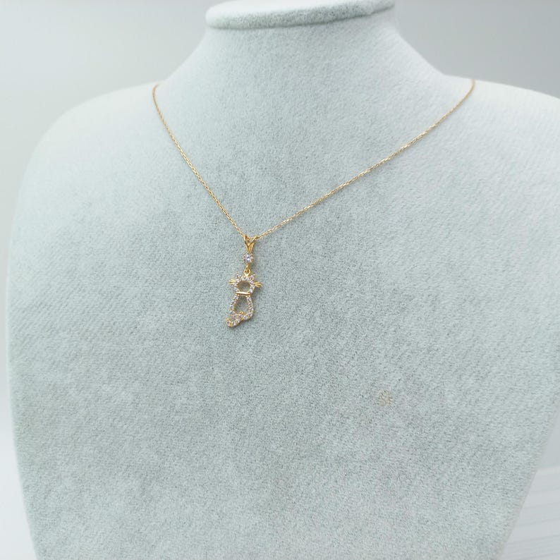 gold cat charm, cat love pendant, cat necklace, golden feline jewelry, playful cat pendant, charming kitty necklace, gold cat jewelry charm