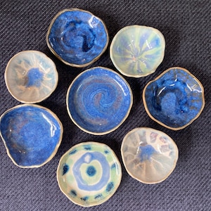 Organic, fluid, ceramic trinket/ tea light dishes, perfect for gifts, display or keeping precious jewellery safe. Tiny trinket dishes