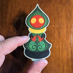 Braxie - Sticker en vinyle mat imperméable représentant le monstre extraterrestre de Flatwoods, la cryptide mignonne du comté de Braxton