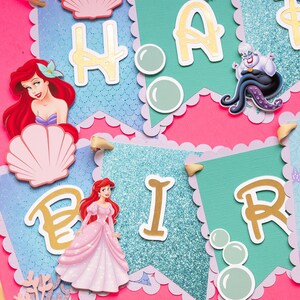 May include: A colorful banner with the words "Happy Birthday" in gold letters. The banner features a mermaid, a seashell, and bubbles. The banner is perfect for a mermaid-themed birthday party.