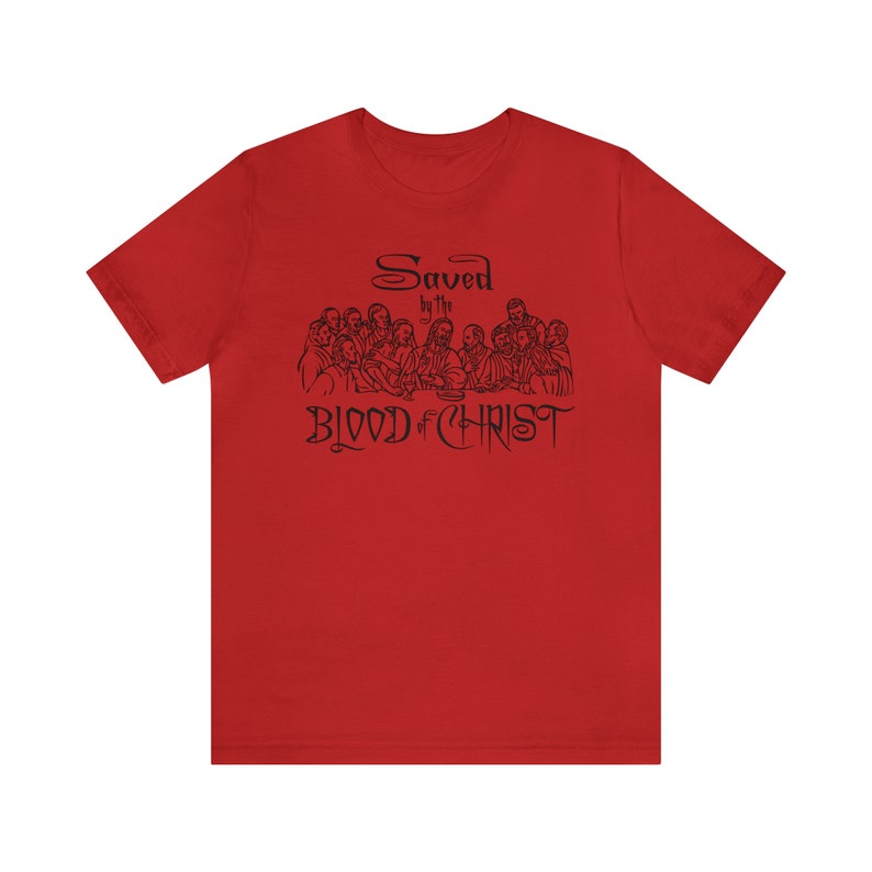 May include: Red t-shirt with a black illustration of the Last Supper and the text "Saved by the Blood of Christ".