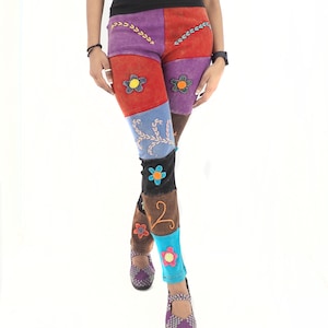 May include: Multicolored patchwork leggings with embroidered flowers. The leggings are made of a soft, comfortable fabric and feature a unique, bohemian style.