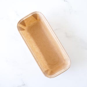 Disposable paper loaf pan on a white background