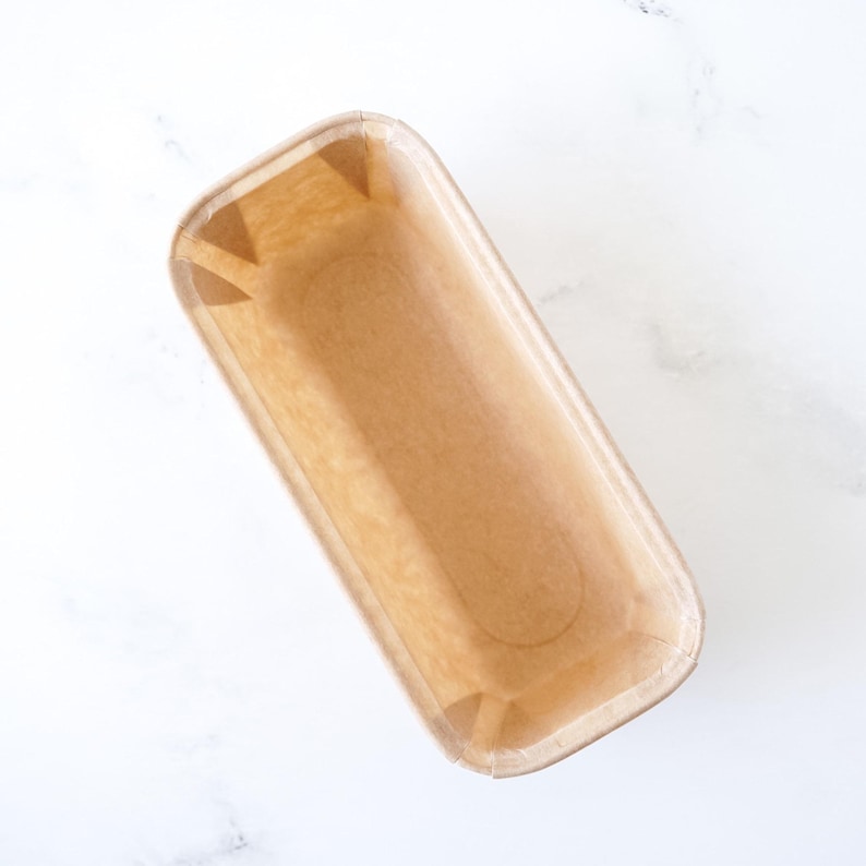 Disposable paper loaf pan on a white background