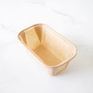 Rectangular paper pound cake pan on a white background