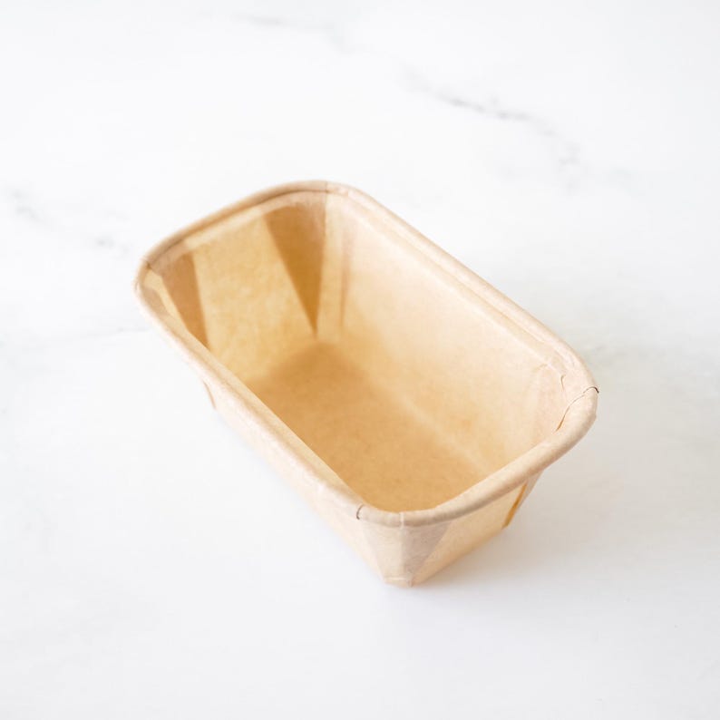 Rectangular paper pound cake pan on a white background