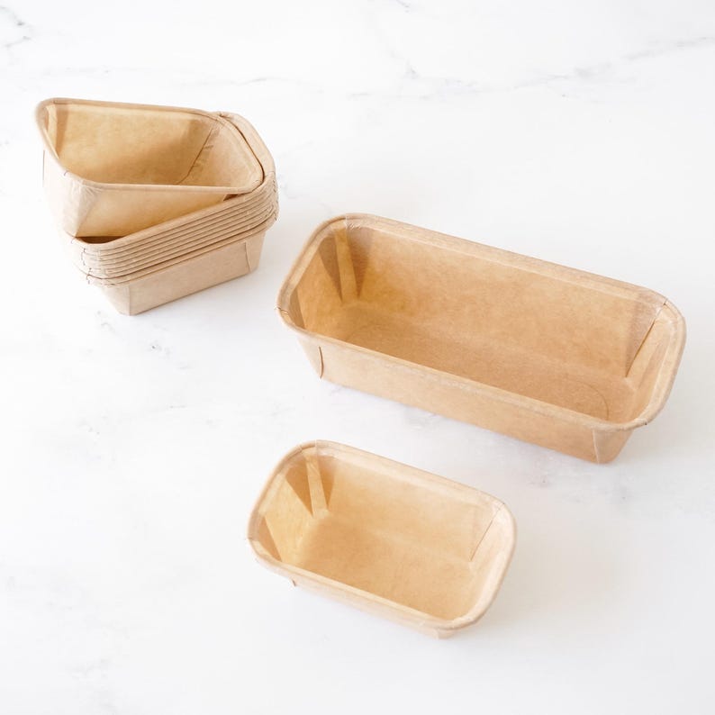 Set of paper bread loaf pans on a white background