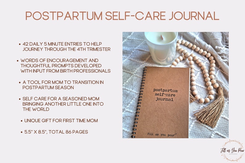 May include: A brown journal with the text "postpartum self-care journal" and "fill as you pour" on the cover. The journal is surrounded by a white candle, a wooden bead garland, and a beige blanket.