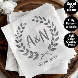 May include: A set of 50 white paper napkins with a gray wreath design, the initials "A&N" and the date "05.08.2025".