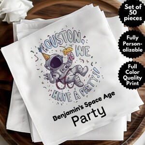 May include: White napkins with a colorful illustration of an astronaut holding a drink, with the text "Houston We Have A Party!!" and "Benjamin's Space Age Party". The napkins are part of a set of 50 pieces, fully personalizable with a full color quality print.
