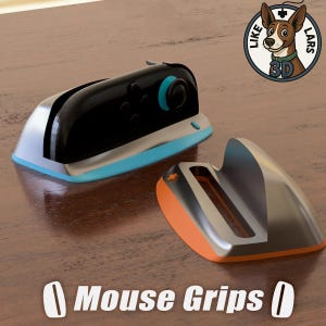 May include: Two mouse grips, one black and silver with blue accents, the other orange and silver. The text "Mouse Grips" is at the bottom of the image. A logo with a dog is in the upper right corner.