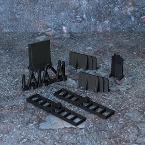 Könnte beinhalten: Ein Set aus schwarzen, kleinen Plastik-Bausteinen für Tabletop-Spiele. Das Set enthält verschiedene Formen und Größen, darunter Wände, Zäune und Treppen.