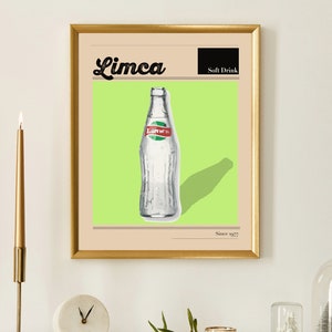 May include: A framed print featuring a vintage Limca soft drink bottle illustration. The artwork has a gold frame, a light green background, and the text "Limca" in a script font. The words "Soft Drink" and "Since 1977" are also visible.