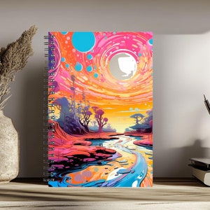 May include: A spiral bound notebook with a colorful abstract design featuring a swirling sky with a large white moon, a river, and trees. The colors are pink, orange, yellow, blue, and green.