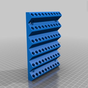 May include: A blue, zig-zag shaped wall-mounted organizer with multiple hexagonal holes. The organizer is designed to hold small items and is made of a solid, durable material. The design is modern and functional, suitable for various organizational needs.