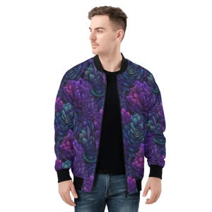 May include: A bomber jacket with a vibrant floral pattern in shades of purple, teal, and magenta. The jacket has a black collar, cuffs, and hem. The model is wearing a black shirt and blue jeans.