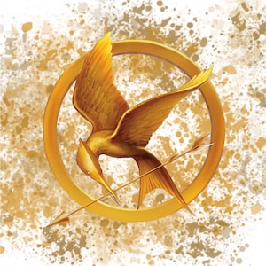 May include: A gold mockingjay bird with a gold arrow through its body, inside a gold circle, on a white background with gold splatters.