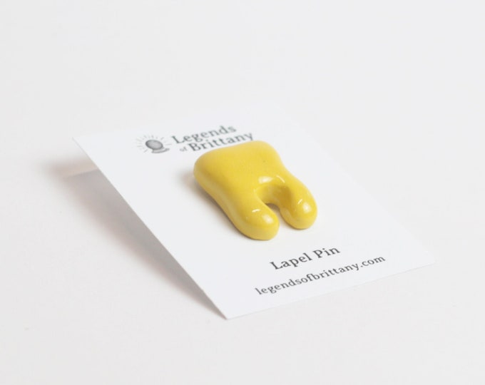 Yellow Tooth Lapel Pin