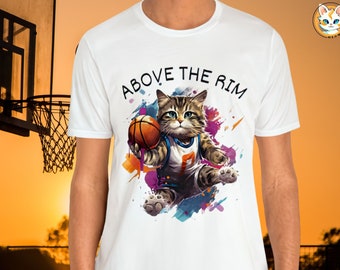 May include: White t-shirt with a graphic of a cat wearing a basketball jersey and holding a basketball. The text "ABOVE THE RIM" is printed on the shirt.