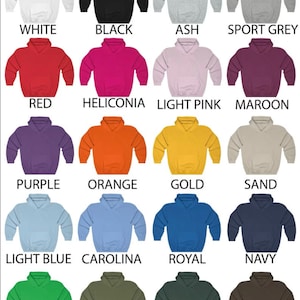 May include: A chart of 16 different colored hoodies, showing the color options available. The colors include white, black, ash, sport grey, red, heliconia, light pink, maroon, purple, orange, gold, sand, light blue, carolina, royal, navy, irish green, military, forest, and dark choco.