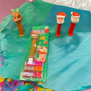 Vintage Santa Claus and Reindeer PEZ Dispensers From 1980 Made in Slovenia s and a 2012 PEZ Santa
